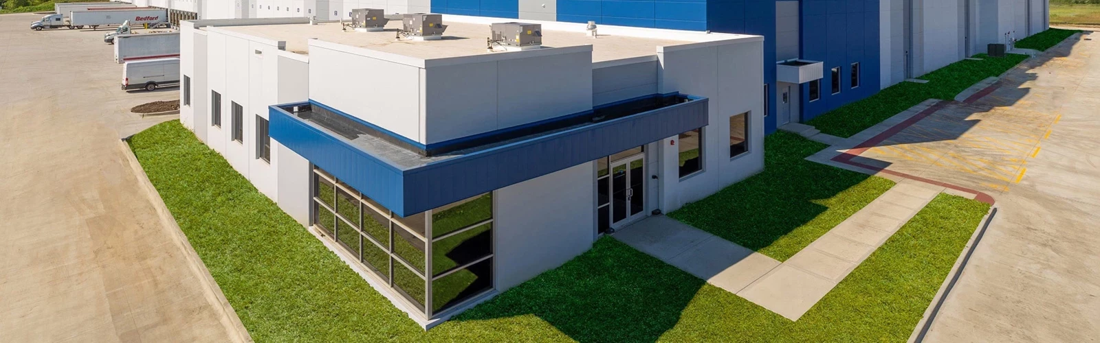 Warehouse that is white with blue instances